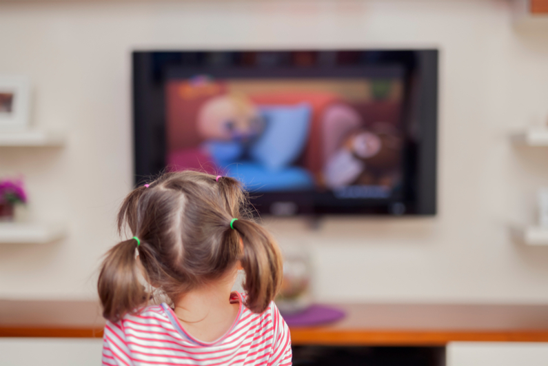 Little girl watching TV